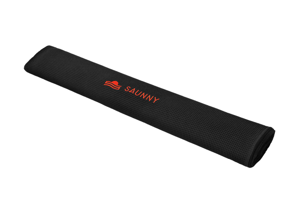 Rolled SAUNNY blanket insert in black waffle cotton texture, featuring the logo embroidered at the center.