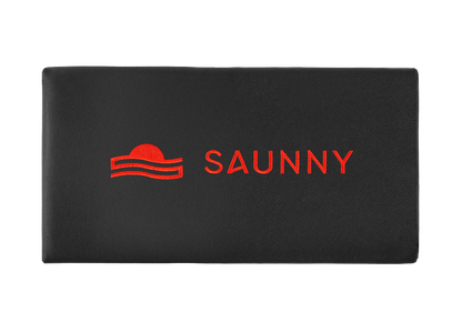 SAUNNY sauna blanket pillow top view, featuring the logo on black premium PU leather surface