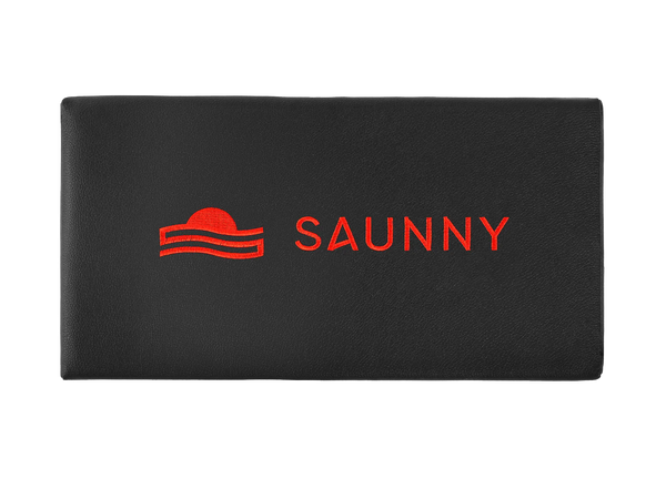 SAUNNY sauna blanket pillow top view, featuring the logo on black premium PU leather surface